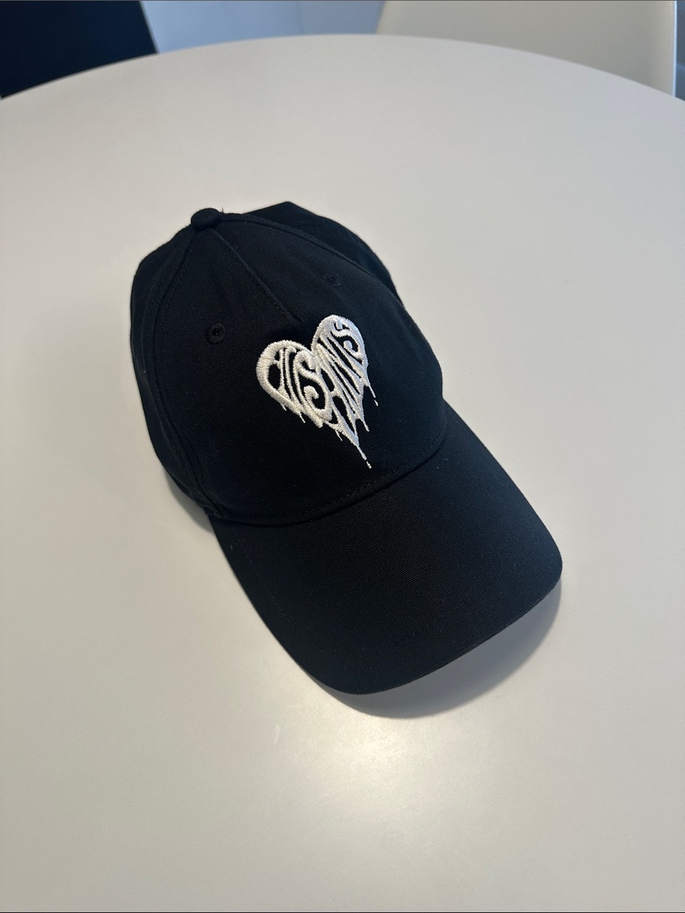 All Saints Black Baseball Cap with White Dripping Heart Embroidery